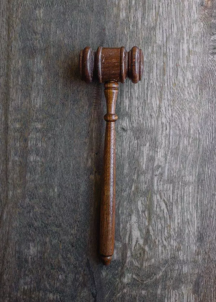A brown wooden mallet.