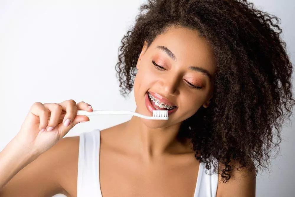 Cheerful african american woman with dental braces